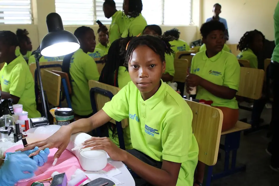 Students attend class at UNICEF-supported Lycée Jean Marie Vincent in Haiti.