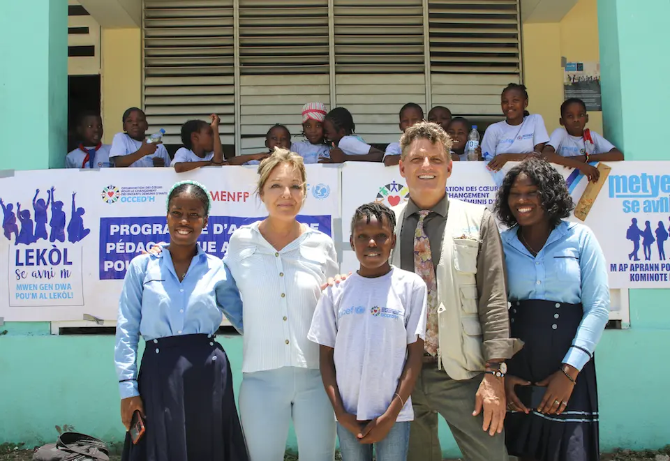 Yasmine Sherif, Education Cannot Wait Executive Director, and Bruno Maes, UNICEF Country Representative, meet students during a visit to Lycée Jean Marie Vincent in Port-au-Prince, Haiti.