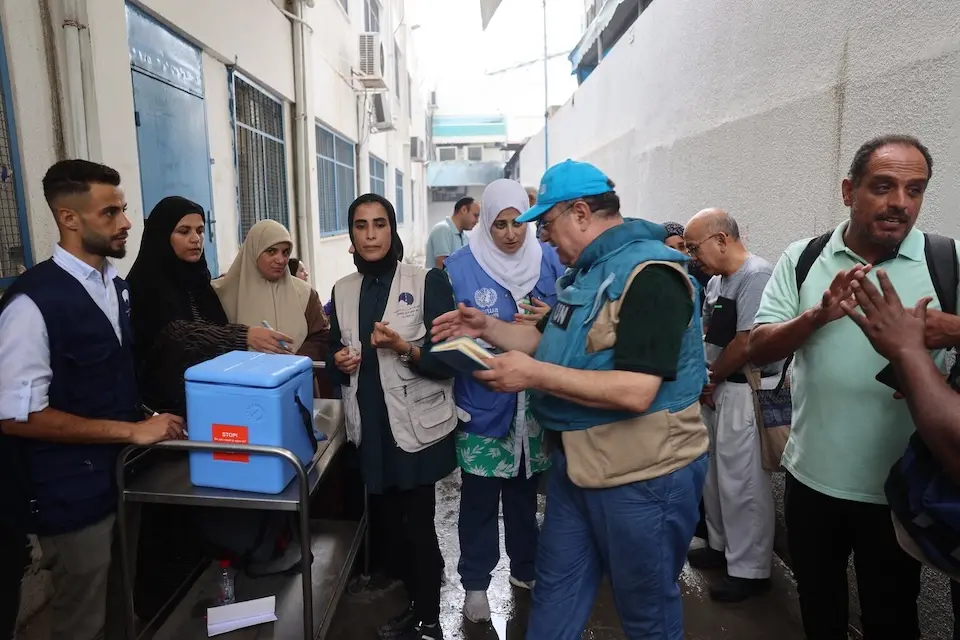 UNICEF staff prepare to administer polio vaccines at UNRWA health clinic in Deir al-Balah in the center of the Gaza Strip.