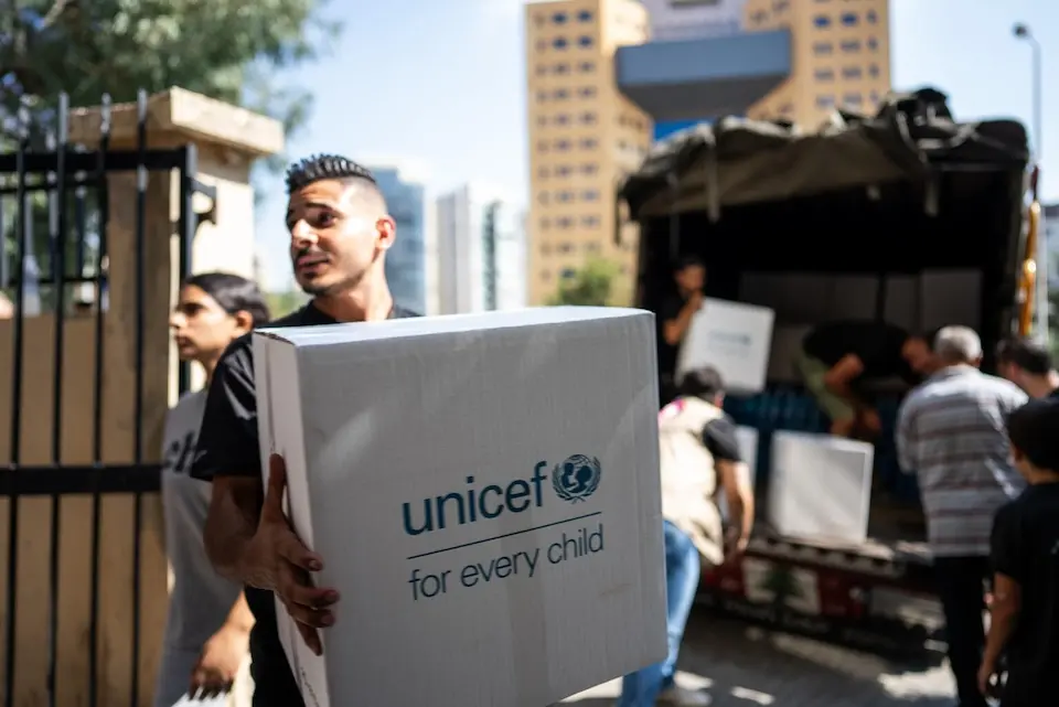 A man holds a box filled with UNICEF emergency supplies in Lebanon on Sept. 28, 2024.