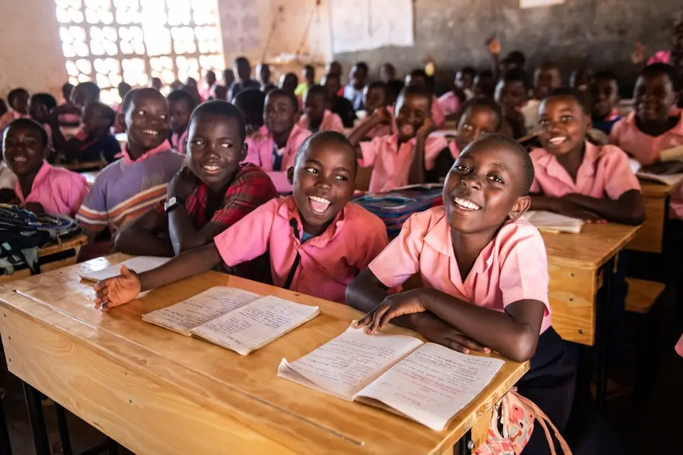 Students at Bwengu Primary School celebrate the arrival of new desks from the K.I.N.D. (Kids in Need of Desks) Fund in Mzimba District, Malawi on Oct. 23, 2024.