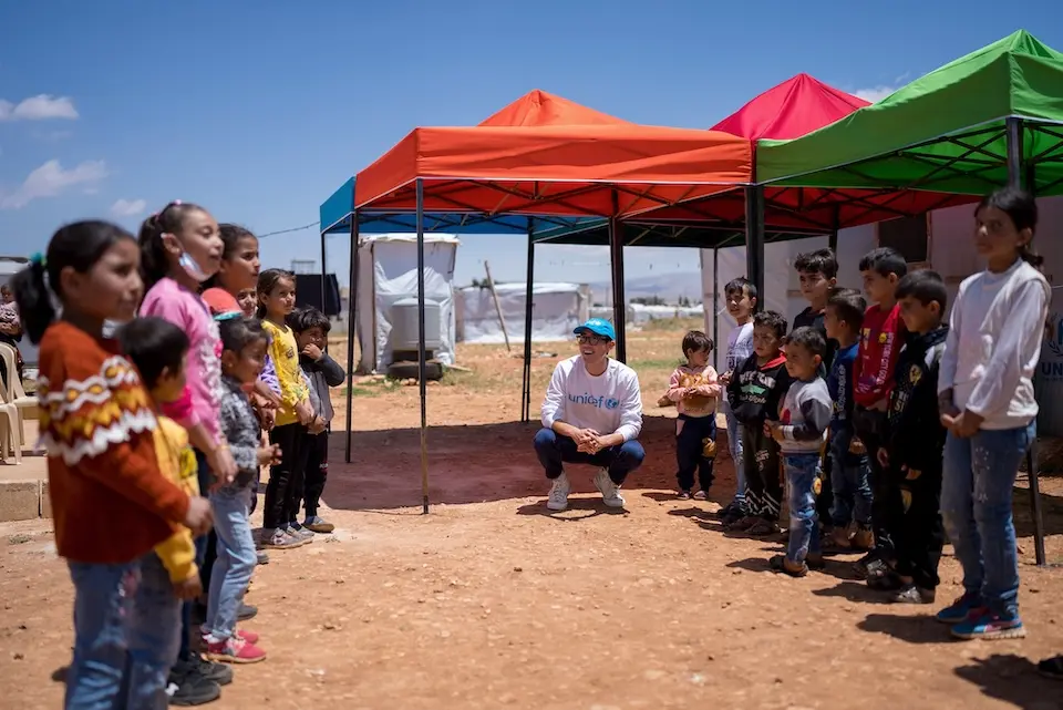Justin H. Min on a program visit with UNICEF.