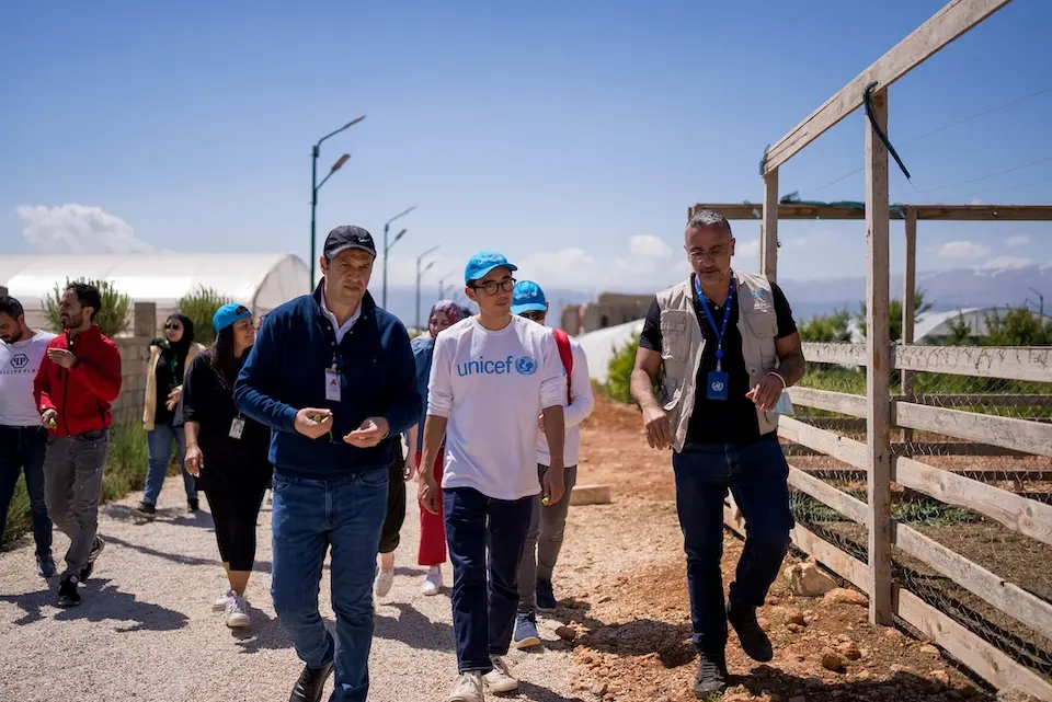 Justin H. Min on a program visit with UNICEF.