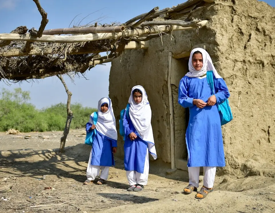 In Mohammad Ramzan Jamot village, Lasbela district, Balochistan province, Pakistan, Aqsa, 10, and two friends visit their old primary school, which had been destroyed in the 2022 floods.