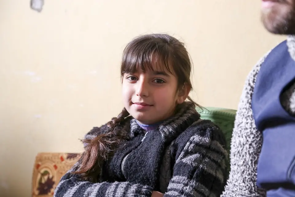 Remas, an 11-year-old beneficiary of UNICEF’s cash assistance program, which provides financial support through cash transfers alongside a holistic support system for vulnerable families, during a UNICEF visit to her home in Hama, Syria, on Dec. 16, 2024.