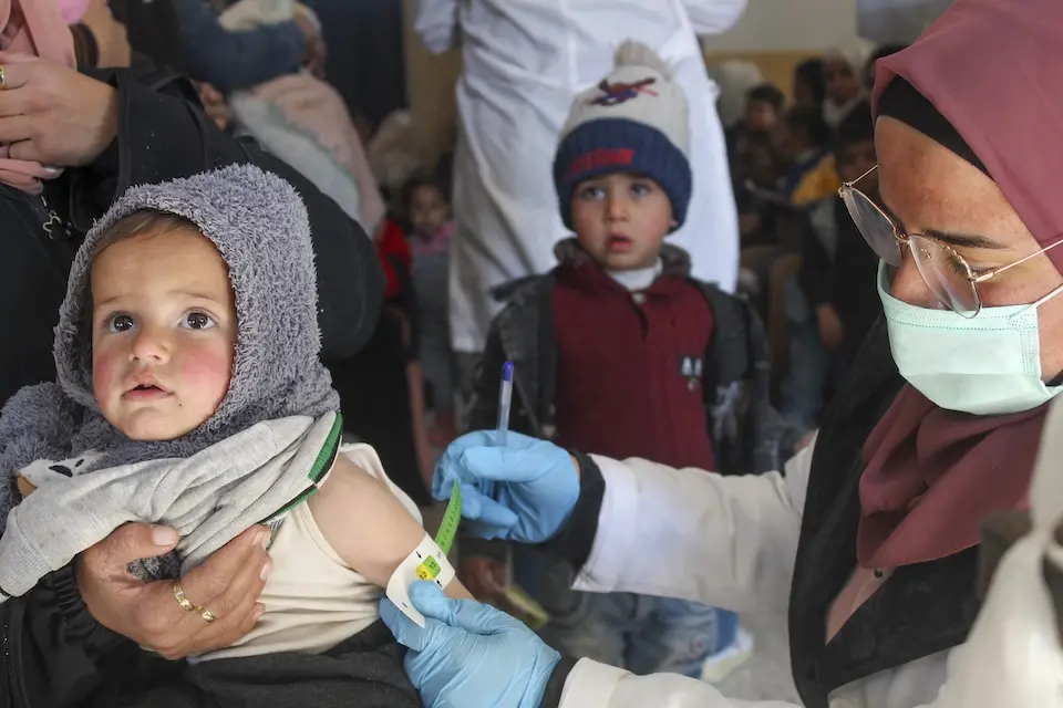 One-year-old Morei is screened for malnutrition by a member of a UNICEF-supported health and nutrition mobile team in Obada village, Rural Damascus, Syria on Dec. 15, 2024.