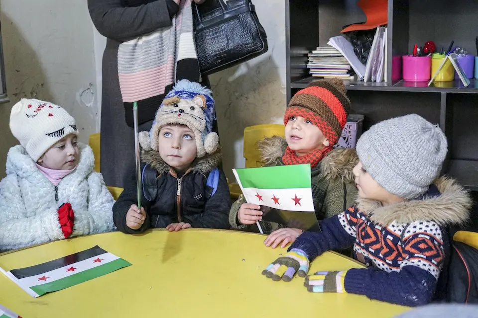 Young students inside a classroom in a UNICEF-rehabilitated school during a visit by UNICEF Regional Director Edouard Beigbeder and UNICEF Syria Representative Yasumasa Kimura to Aleppo, Syria, on Dec. 17, 2024.
