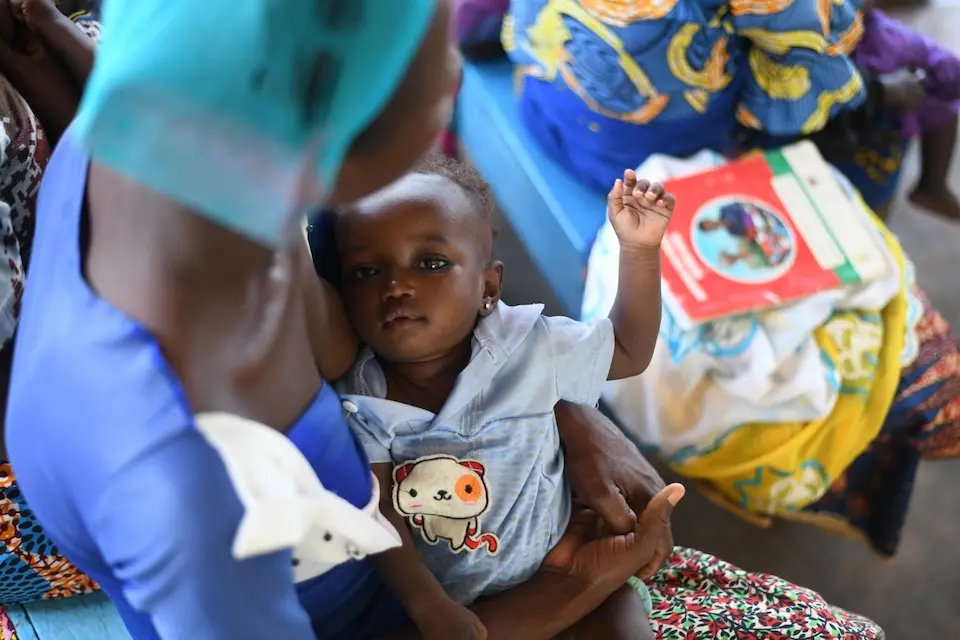 A woman and her child attend a Community-Based Management of Acute Malnutrition Program at Karaga Health Center in the Northern Region of Ghana.