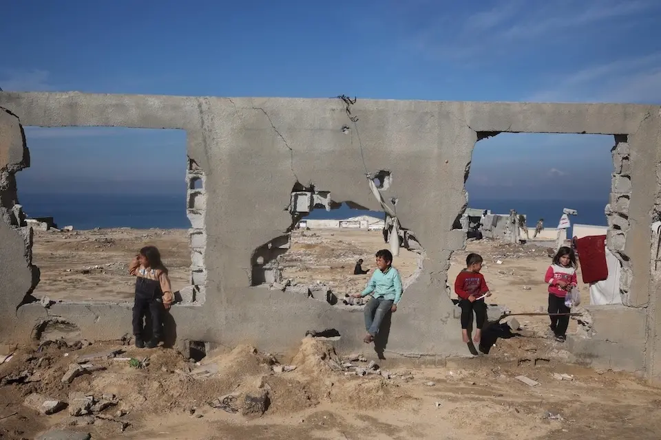 Children and their families wait in Al Nuseirat, in the central Gaza Strip, for the green light to begin their journey back home to Gaza City and the northern areas, after 15 months of displacement.