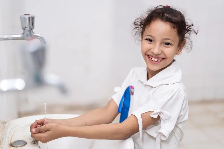 A student washes her hands in Fatima Al Zahra primary and secondary school restrooms in Khanfir District, Abyan Governorate, Yemen.