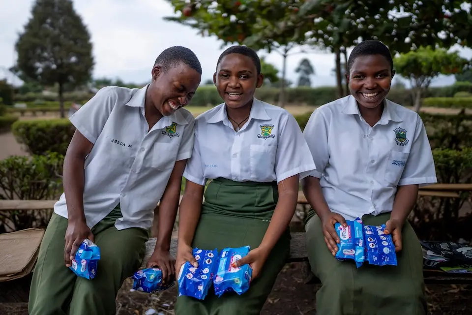 Students from Nyabugando Baptist Vocational College receive reusable sanitary pads with the support of UNICEF.