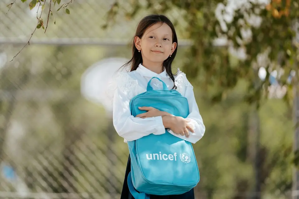 Darya, a 10-year-old refugee from Ukraine, holds her UNICEF bookbag outside her new school in Chisinau, Moldova.