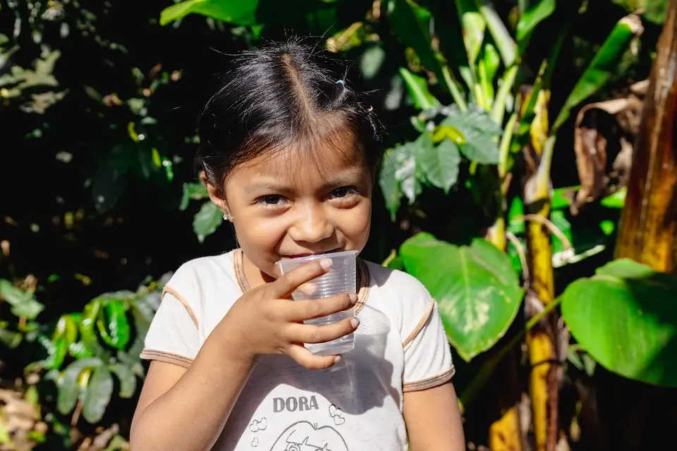 Six-year-old Damaris, who lives in the village of Santa Ana Oriental, in San Juan Chamelco, Alta Verapaz department, Guatemala, holds a cup of water that is safe to drink thanks to efforts by UNICEF and partners to improve water systems in the country.
