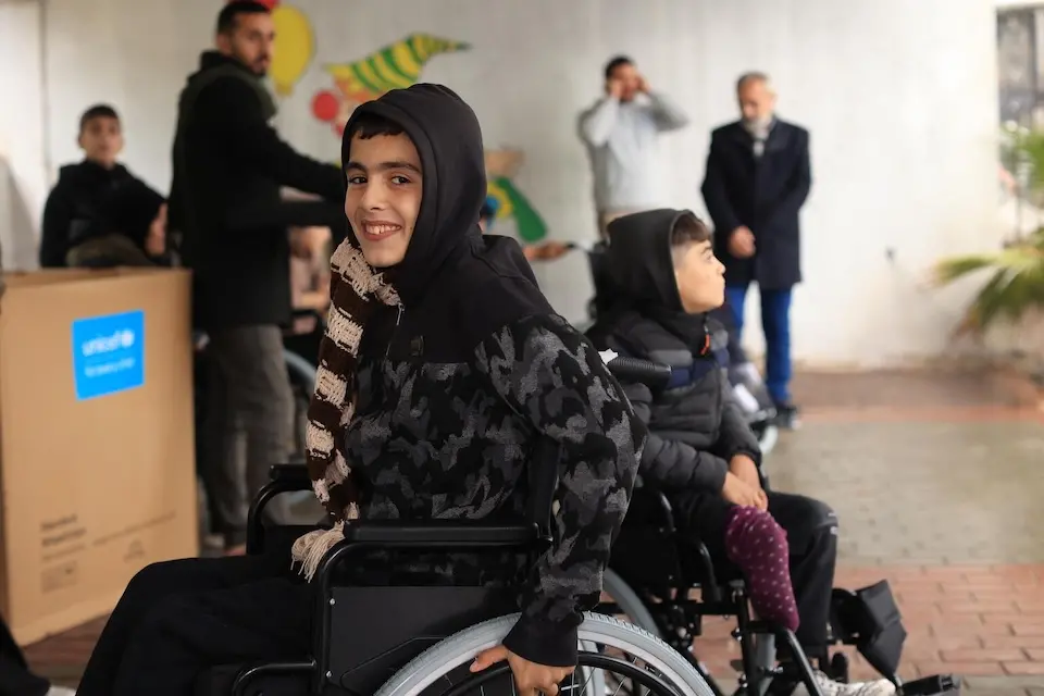 In the Gaza Strip, children with injuries caused by the war and with pre-existing disabilities receive wheelchairs from UNICEF.
