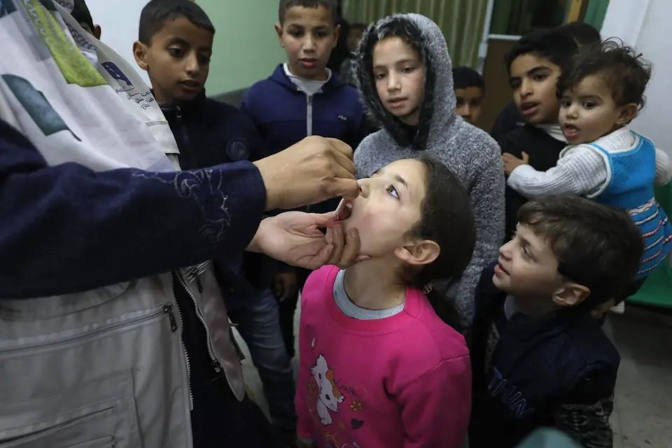 Children crowd in to receive their polio vaccine at Burij Health Clinic in the Middle Area of the Gaza Strip on Feb. 22, 2025.