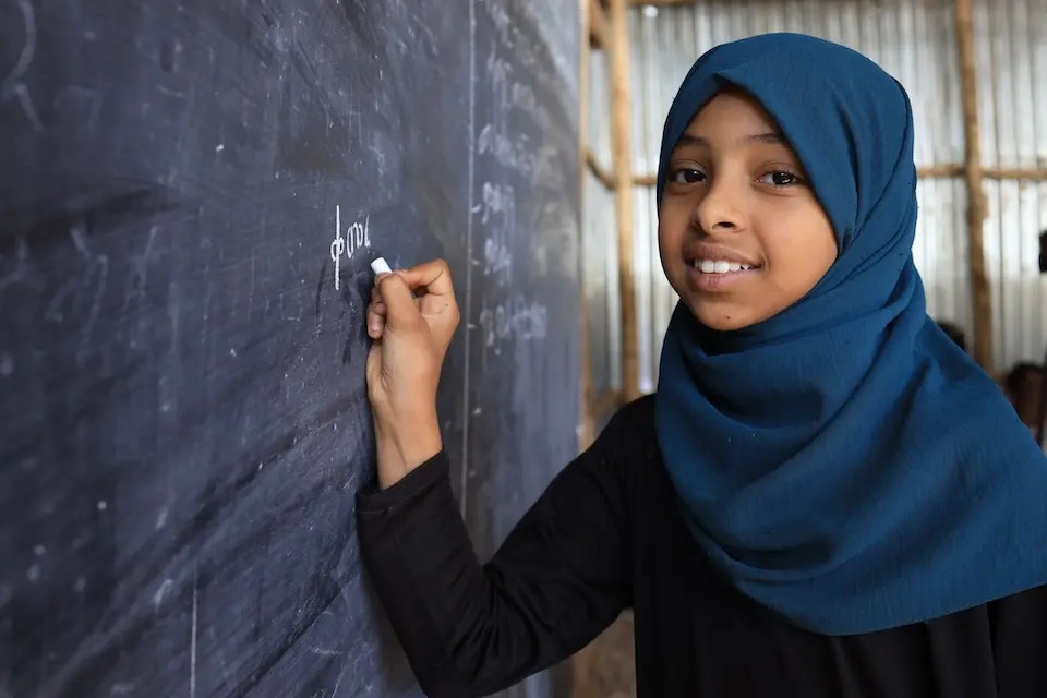 A student writes on the blackboard in the ECW-supported Embandaso School in the Tigray region of Ethiopia.