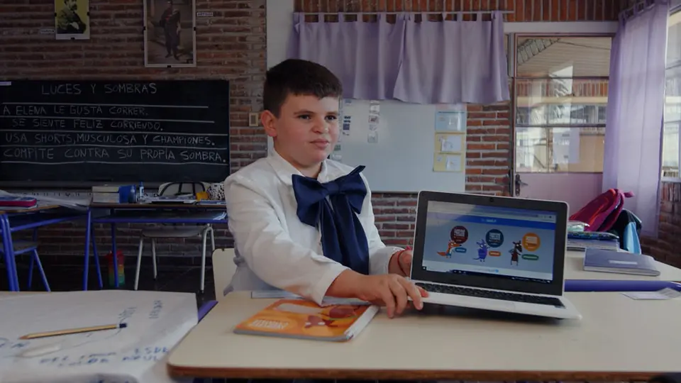José, 10, showing the main page of the books on his computer in Rocha, Uruguay.
