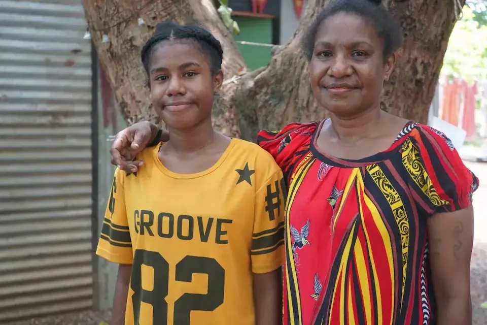 Jovensha, 14, with her mother in Papua New Guinea.