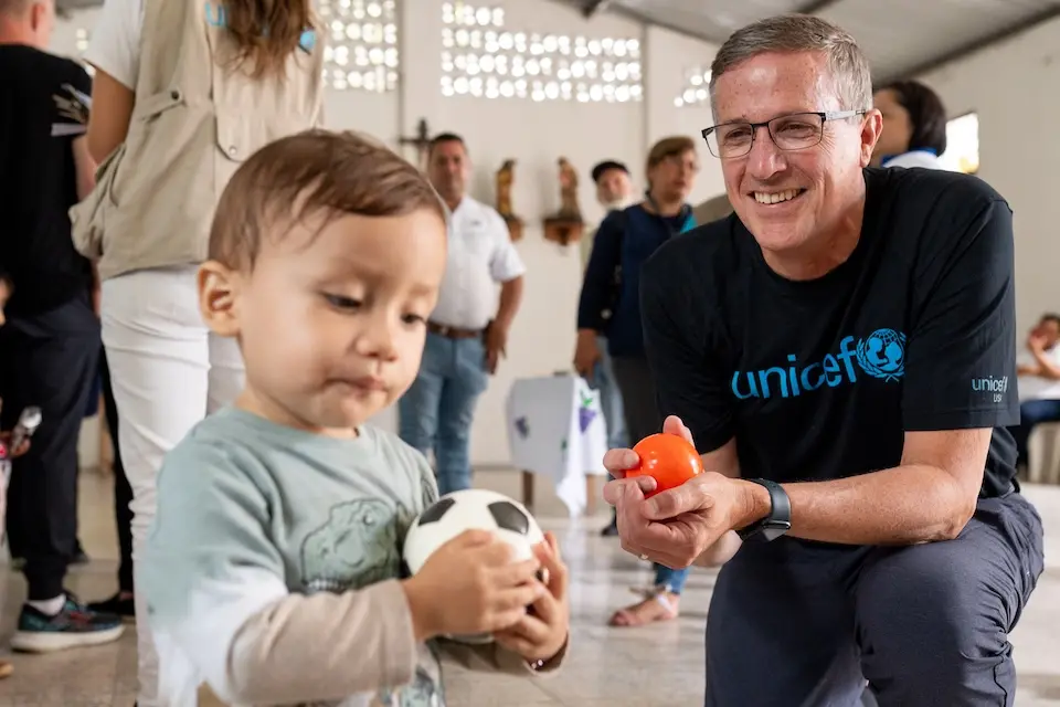 On July 31, 2024, in Chiquimula, Guatemala, Michael J. Nyenhuis, President and CEO of UNICEF USA, plays with Mario Jose Leiva Ainto, 10 months old, during an ECD session at the CECODII (Community Centers for Comprehensive Child Development) supported by UNICEF that promote the comprehensive development of children.