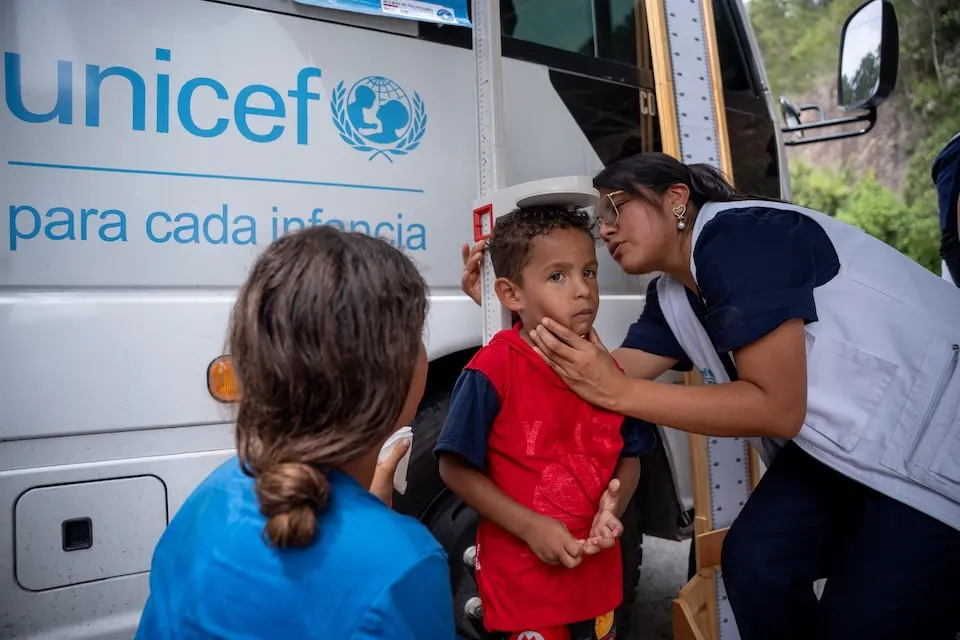 Four-year-old Tiago is measured by a health worker, part of a nutritional health check at a UNICEF-supported mobile unit in Esquipulas, Guatemala, near the border with Honduras.