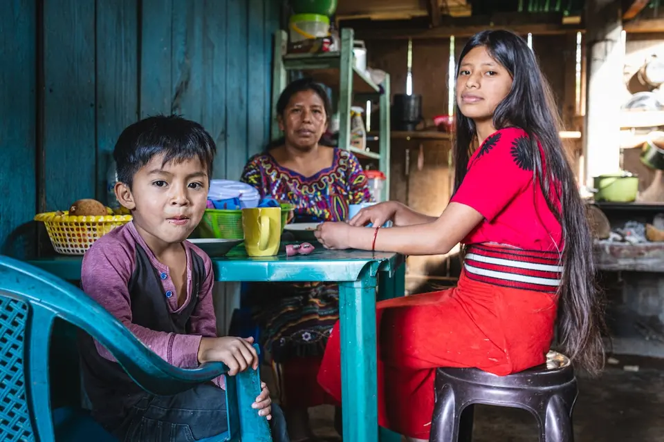 Juana Brito Corio, 38, eats lunch with her daughter Cecilia, 14, and nephew Diego, 5, In La Pista Nebaj, Quiché, Guatemala,