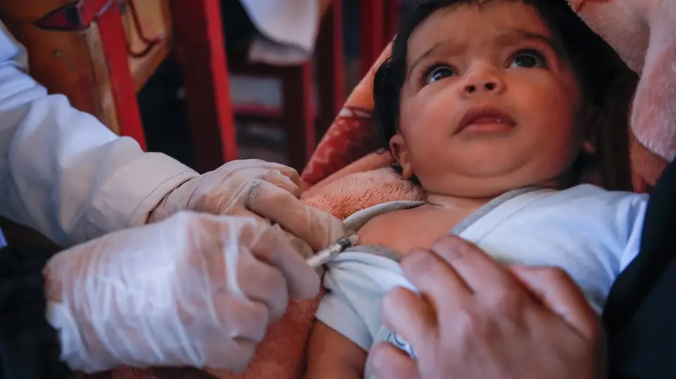 Three-month-old Nawaf is vaccinated at a UNICEF mobile clinic in Yemen.