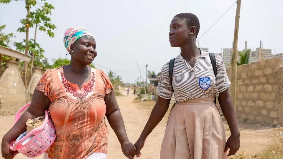 Faustina, a 15-year-old girl from Kasoa, central Ghana, with her mother Janet.
