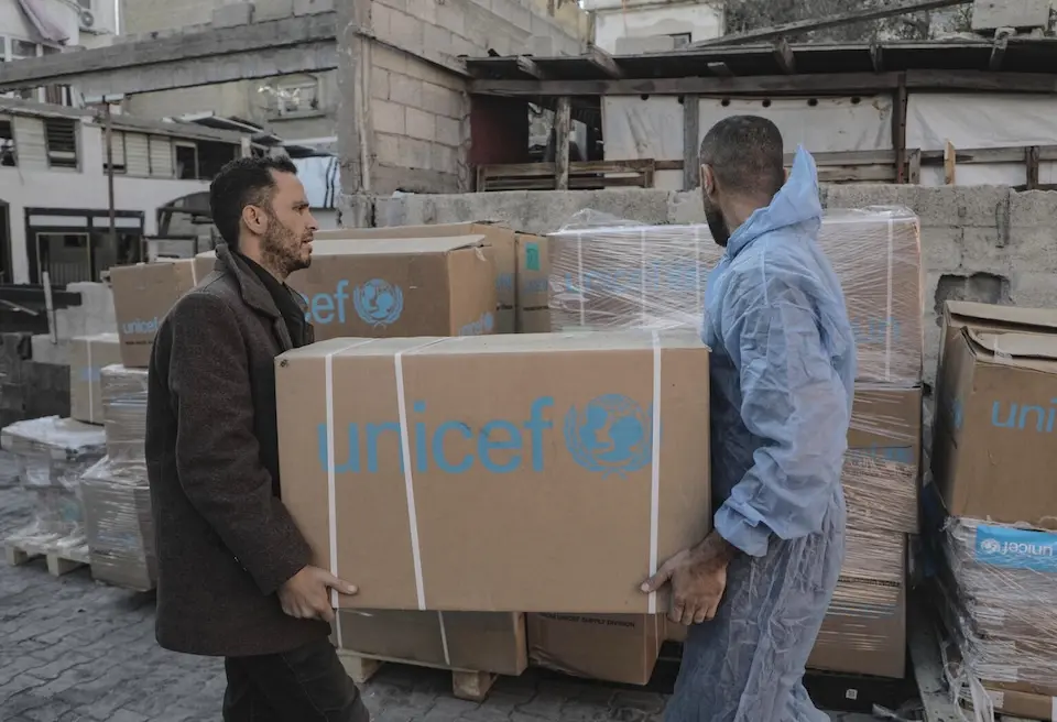 Air workers move boxes of essential medical supplies for children Al Awda Hospital north of Gaza city on Feb. 20, 2025.