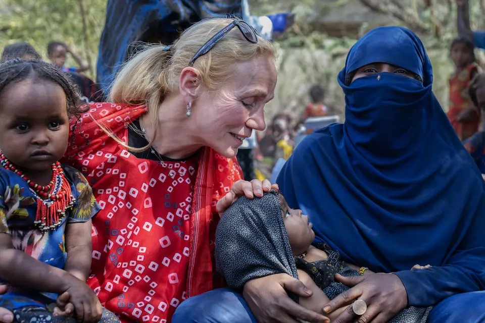 On March 16, 2025 in Ethiopia, UNICEF Deputy Executive Director Kitty van der Heijden visits with children and families receiving services from a UNICEF mobile health and nutrition team in the Afar region.