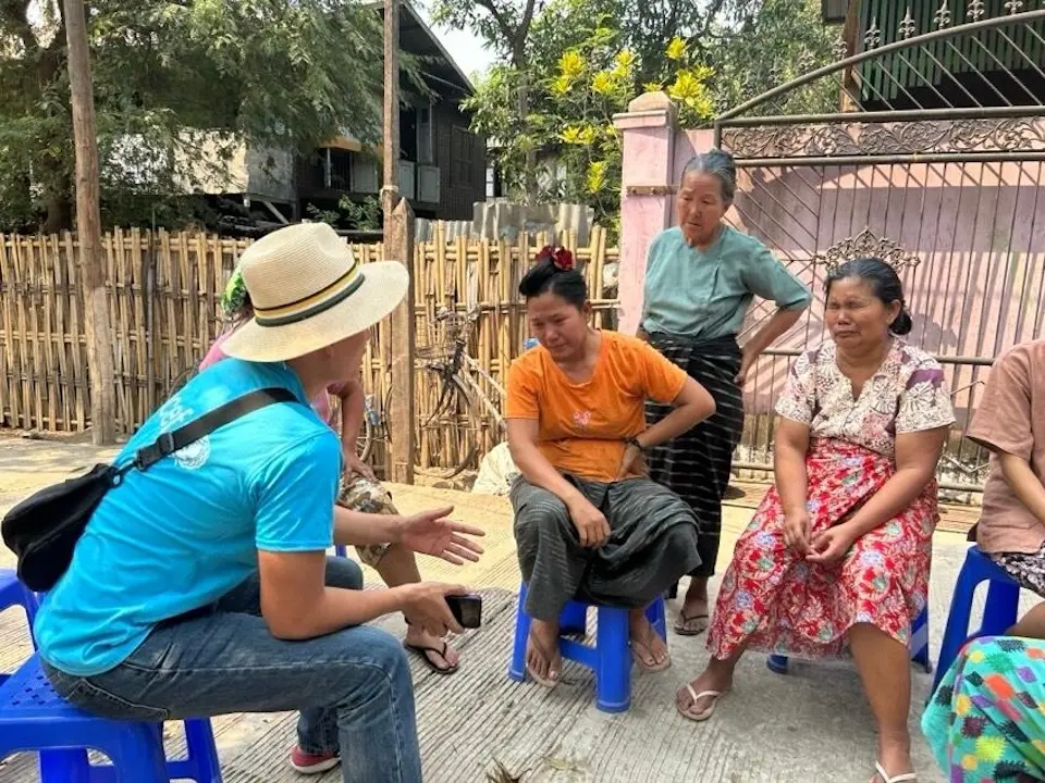 Women from earthquake-affected families in Nay Pyi Taw gather with a UNICEF Myanmar staff member to discuss their situation and needs on March 29, 2025, one day after the devastating earthquake.