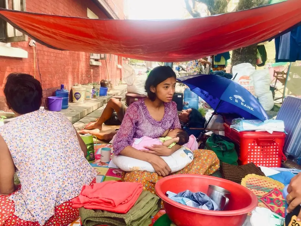 Children and families take shelter in makeshift outdoor spaces in Mandalay, Myanmar, following the devastating 7.7 magnitude earthquake that struck on March 28, 2025.