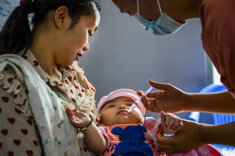 A baby in Myanmar is vaccinated as part of a catch-up immunization campaign supported by UNICEF.