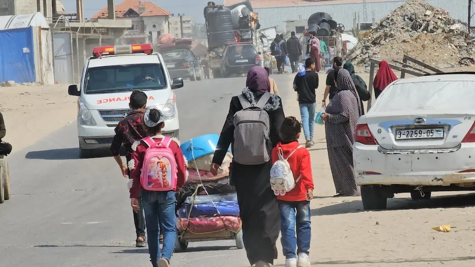 Following displacement orders in different areas of the Gaza Strip, families from eastern areas of Khan Younis move west on March 18, 2025.