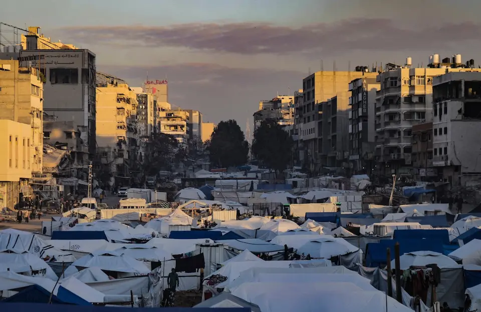 Makeshift tents set up by displaced families fill Omar Al Mokhtar Street in Gaza City on March 22, 2025.