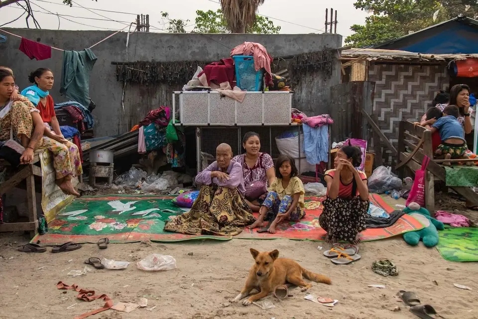 On April 7, 2025, families displaced by the recent earthquake sit together on mats in an open space in Chan Thar Kone village, Mandalay region, Myanmar.