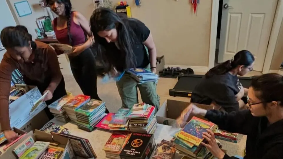 UNICEF Club members sort donated books for shipment to children in Kenya.