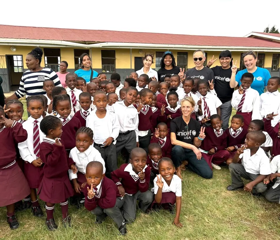 UNICEF USA staff with students in Mthatha, South Africa during a program visit to see UNICEF programs in action.