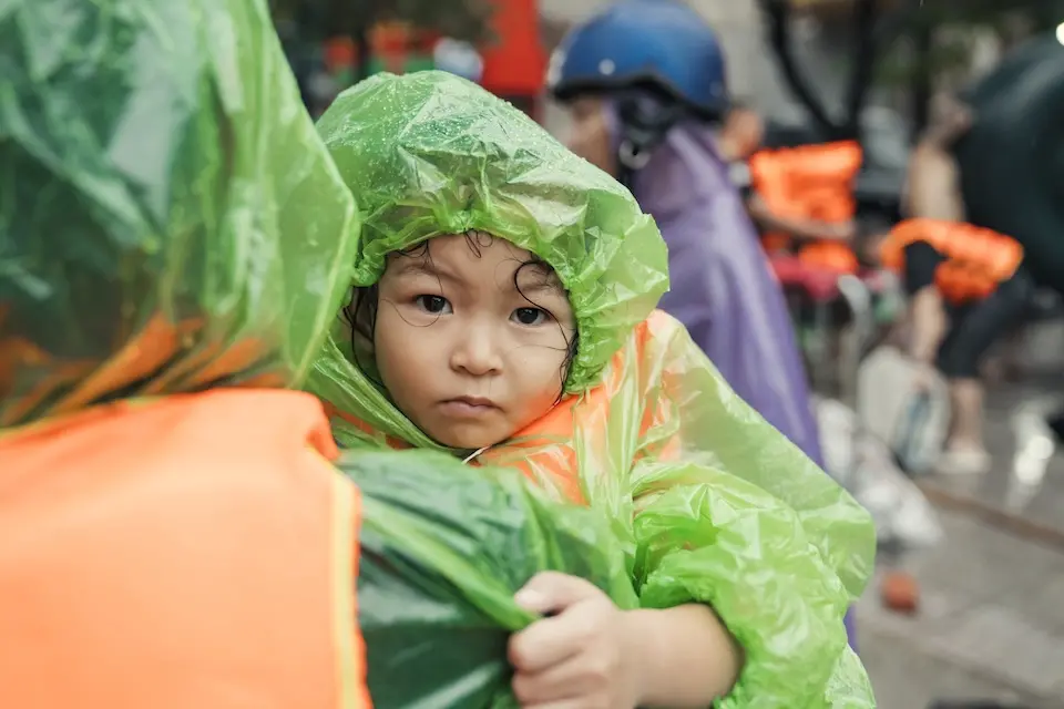 A 3-year-old girl is carried to safety as flooding caused by Super Typhoon Yagi overtakes her community in northern Vietnam.