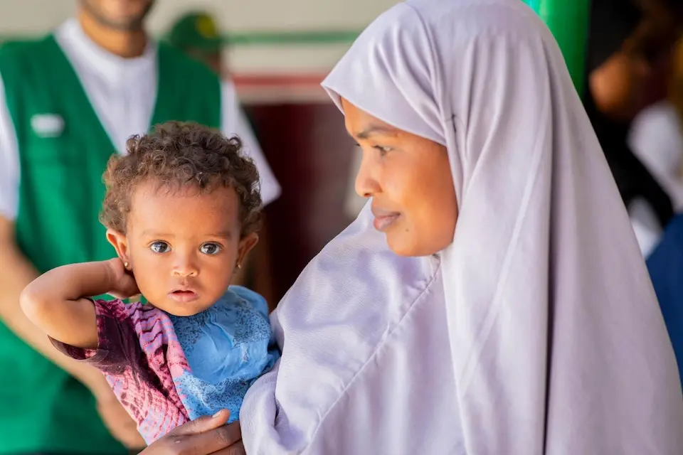 A mother holds her 11-month-old daughter, who is being treated for severe acute malnutrition, at a UNICEF-supported health center in Burao, Somaliland.