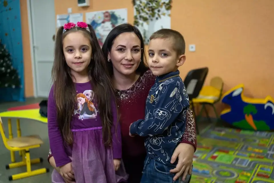 Six-year-old twins and their mother in Zaporizhzhia, Ukraine.