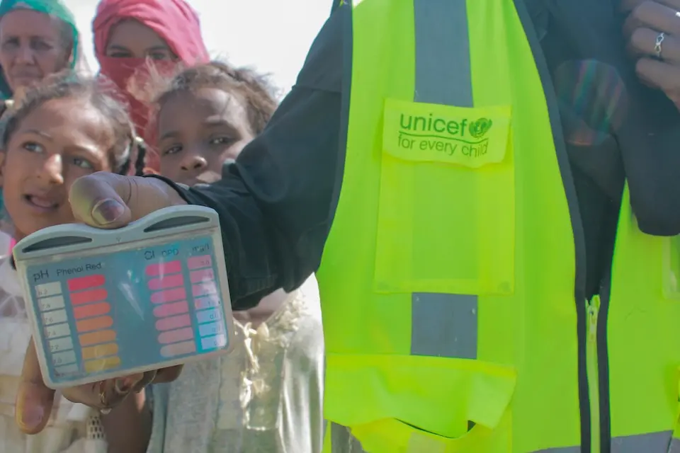 UNICEF checks water quality at a camp for displaced children and families in Sudan.