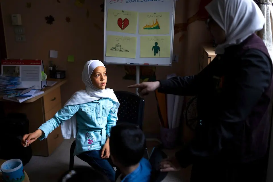 Basima, 11, attends a UNICEF child protection session on the dangers of explosive remnants of war in Syria..