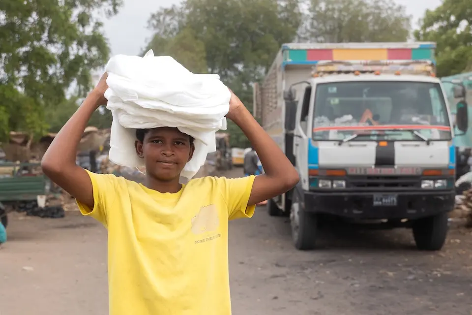 On May 30, 2025, Mohammed 12, received bed nets from a UNICEF supply distribution center in Arabee village in Damazine, Blue Nile state, Sudan.