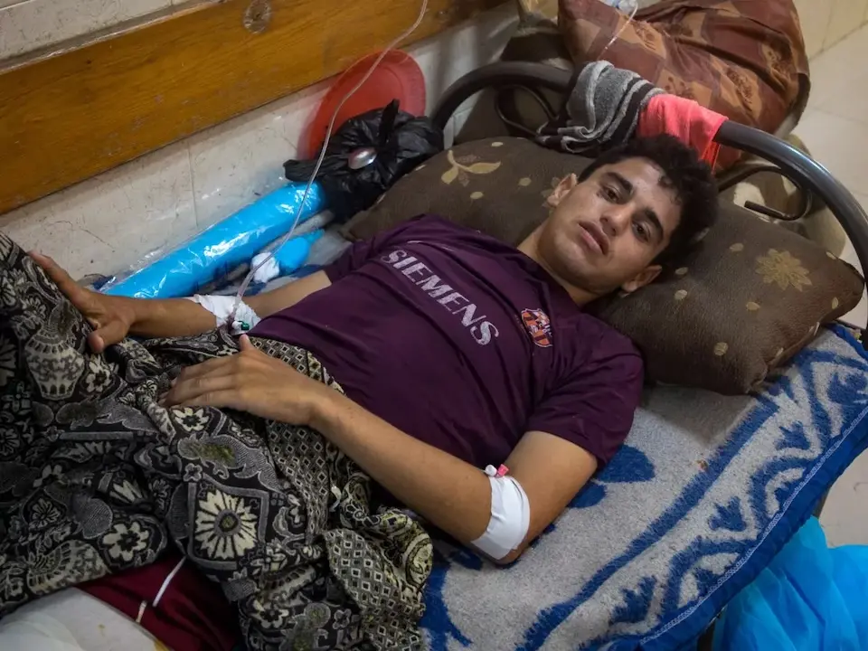 A 17-year-old injured by shelling while waiting at a non-UN distribution site in the Gaza Strip.