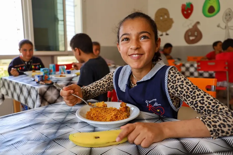 A child enjoys a meal at the Sidi Makhlouf Children's Complex in Tunisia.