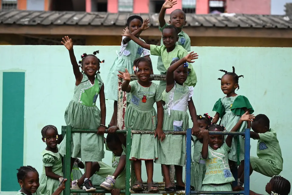 Children play outside their school in Abobo, southern Côte d’Ivoire.