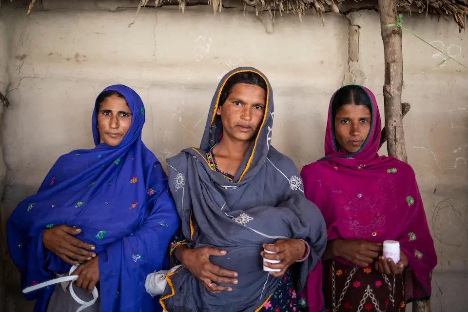Three pregnant women attend UNICEF-supported nutrition information session in Thatta, Sindh, Pakistan.