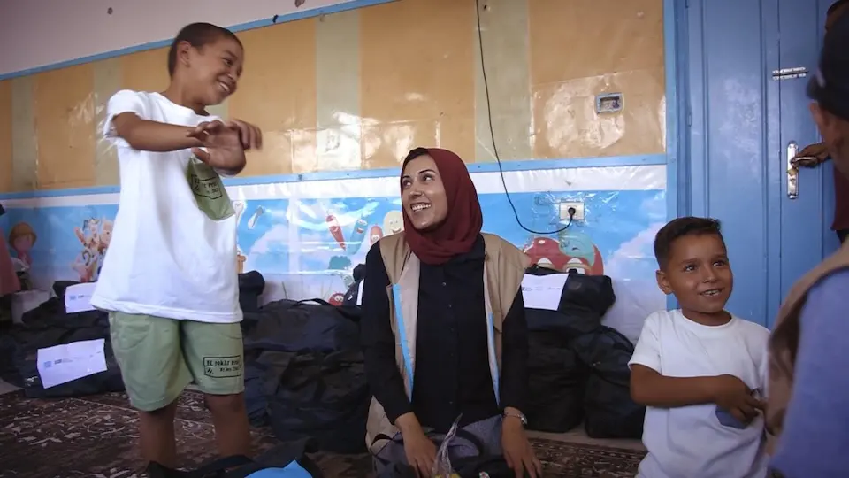 Fairuz Abuwarda, UNICEF Coordinator in Gaza, with children in the Gaza Strip during an epic polio vaccination campaign in the middle of war in 2024.