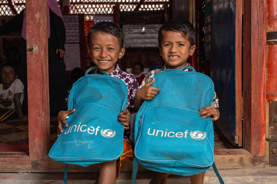 On Jan. 13, 2025, children sit outside a UNICEF learning center in the Rohingya refugee camps in Cox’s Bazar, Bangladesh.