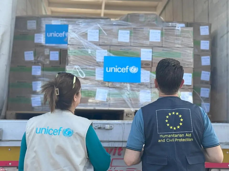 Humanitarian aid workers look into a truck loaded with therapeutic food n Israel, on their way to enter the Gaza Strip via the Kerem Shalom border crossing on Aug. 26, 2025.